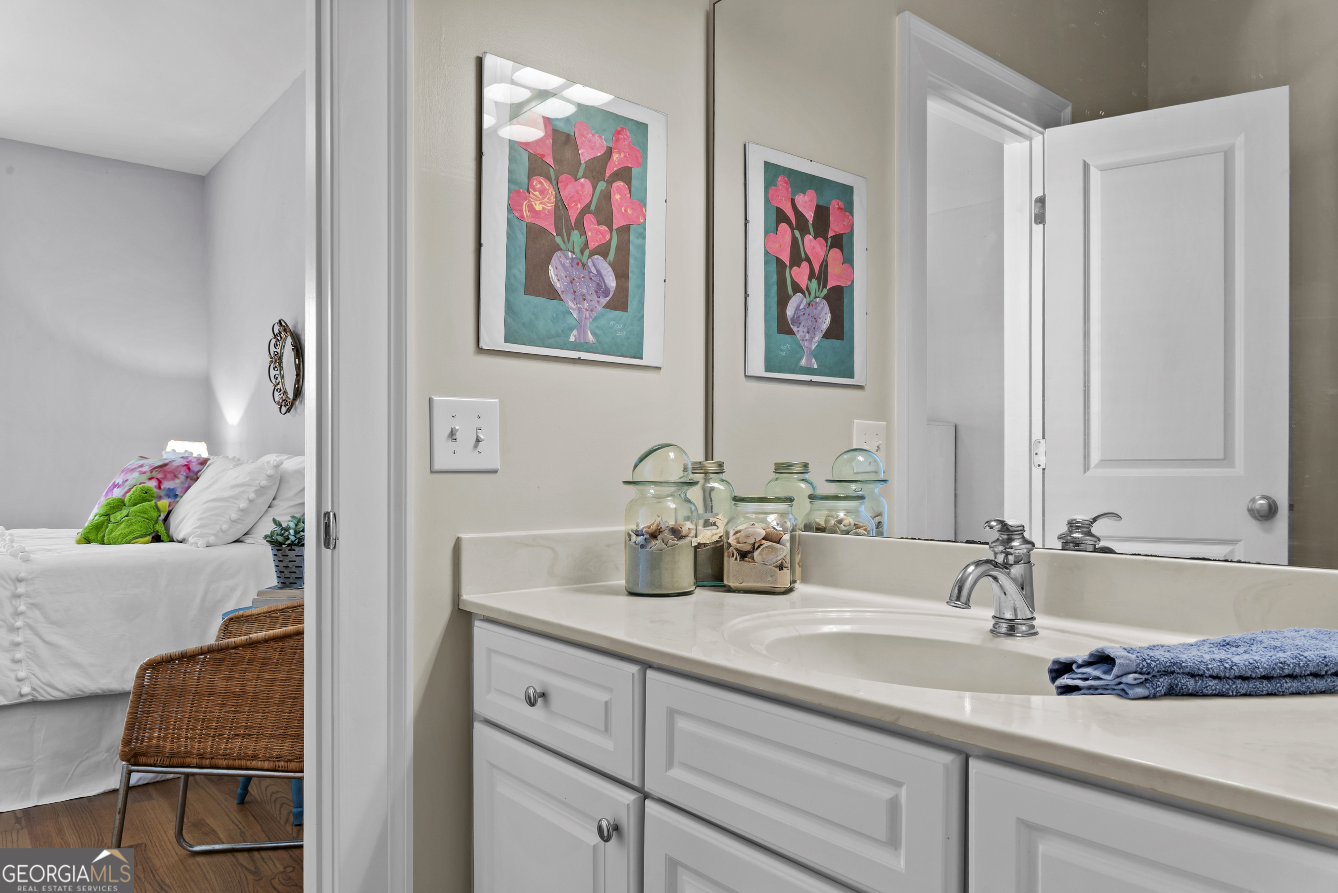 568 New Post Road Madison, GA 30650 - Photo 36 of 58 a bathroom with sink and a mirror