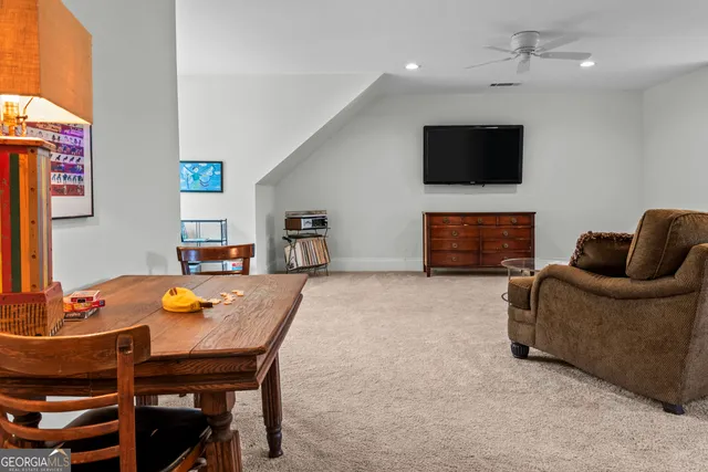 a bedroom with a bed and a book shelf
