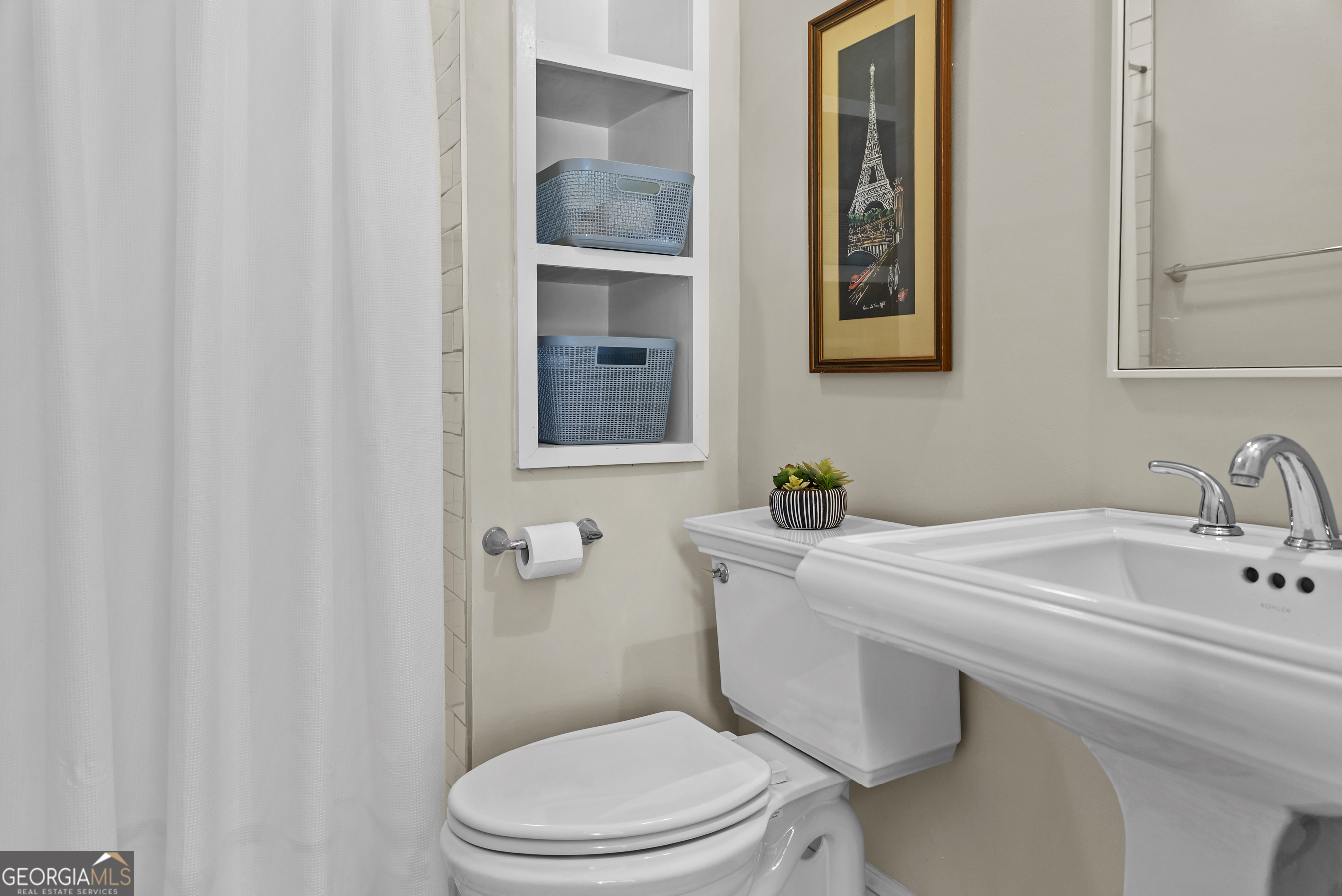 568 New Post Road Madison, GA 30650 - Photo 50 of 58 a bathroom with a sink a toilet and mirror