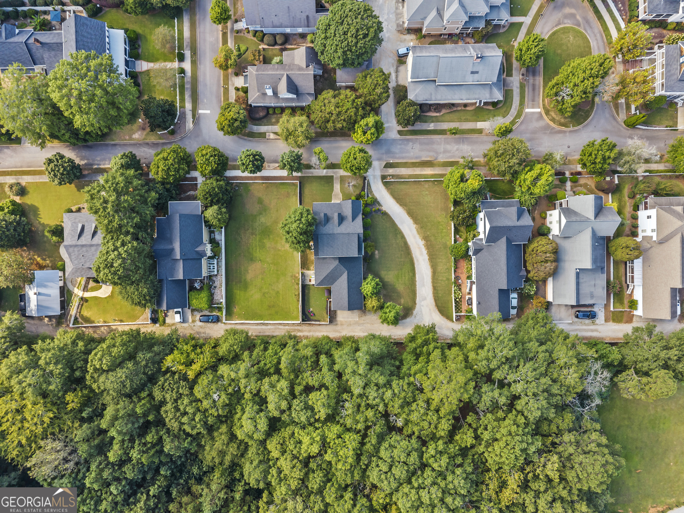 568 New Post Road Madison, GA 30650 - Photo 58 of 58 an aerial view of a house with a yard and swimming pool