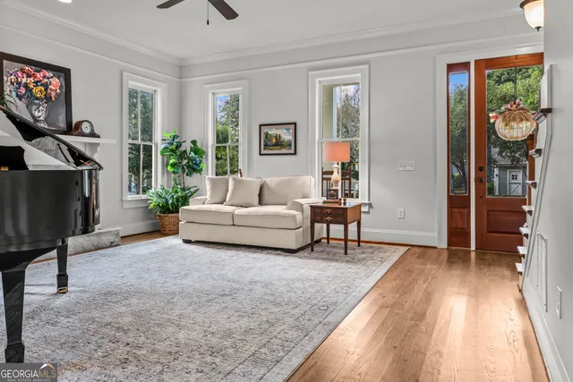a dining room with furniture and wooden floor