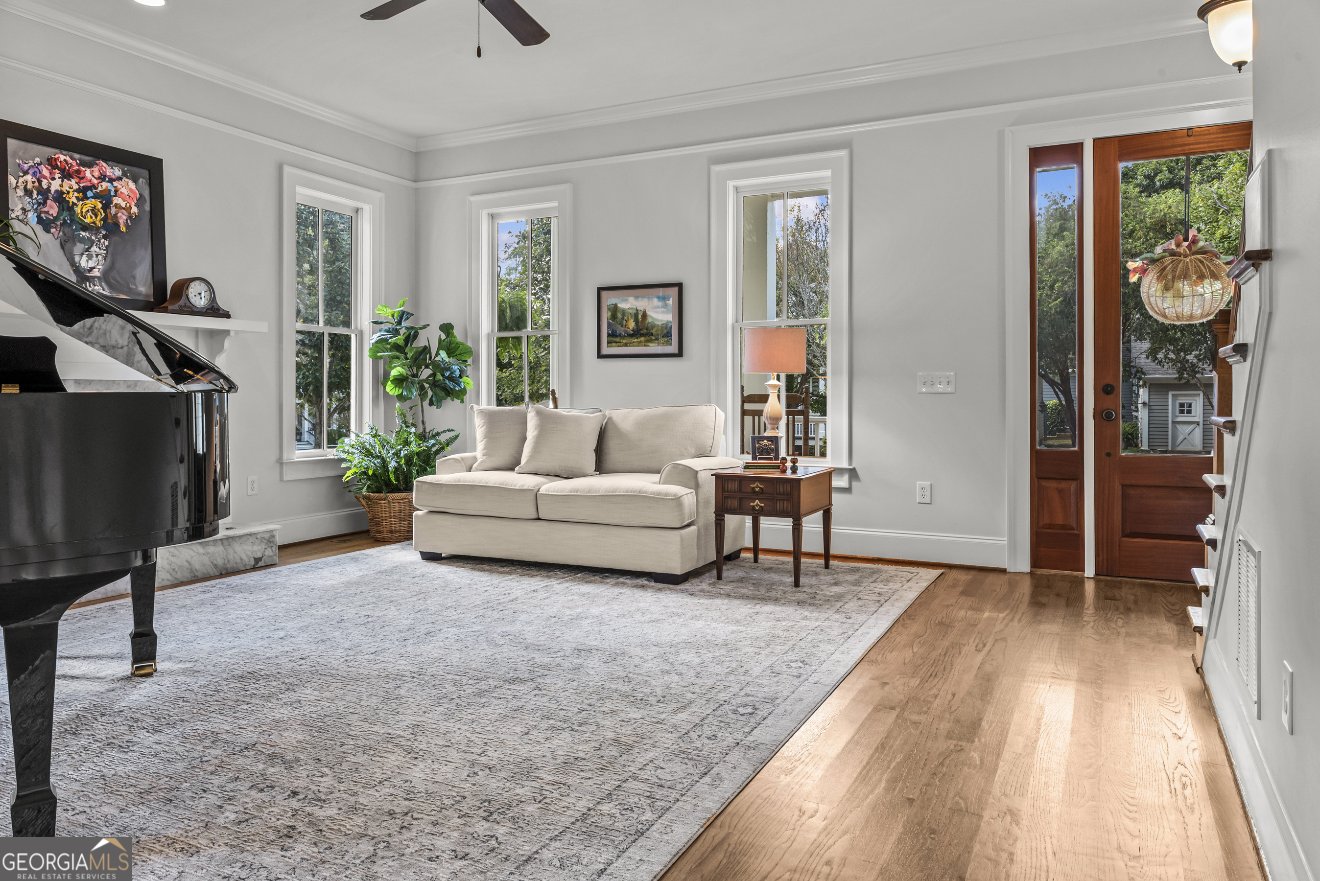 568 New Post Road Madison, GA 30650 - Photo 6 of 58 a living room with furniture and a flat screen tv