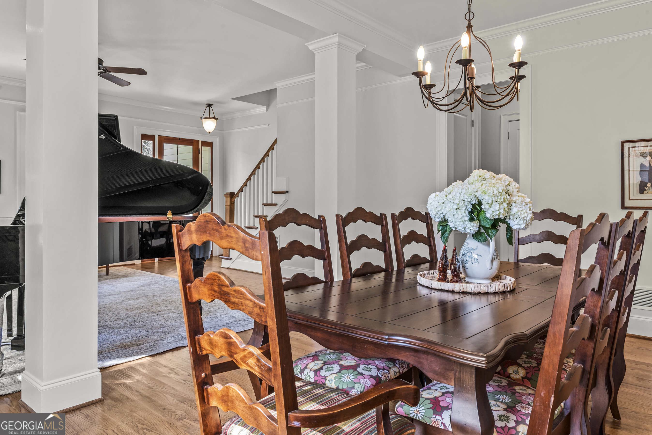 568 New Post Road Madison, GA 30650 - Photo 7 of 58 a dining room with furniture and wooden floor