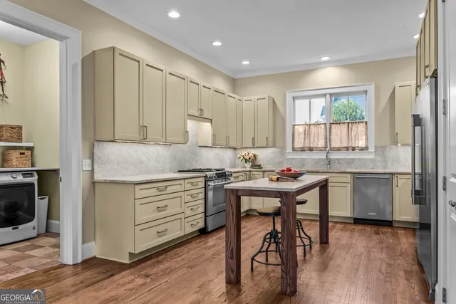 a kitchen with a sink stove and refrigerator