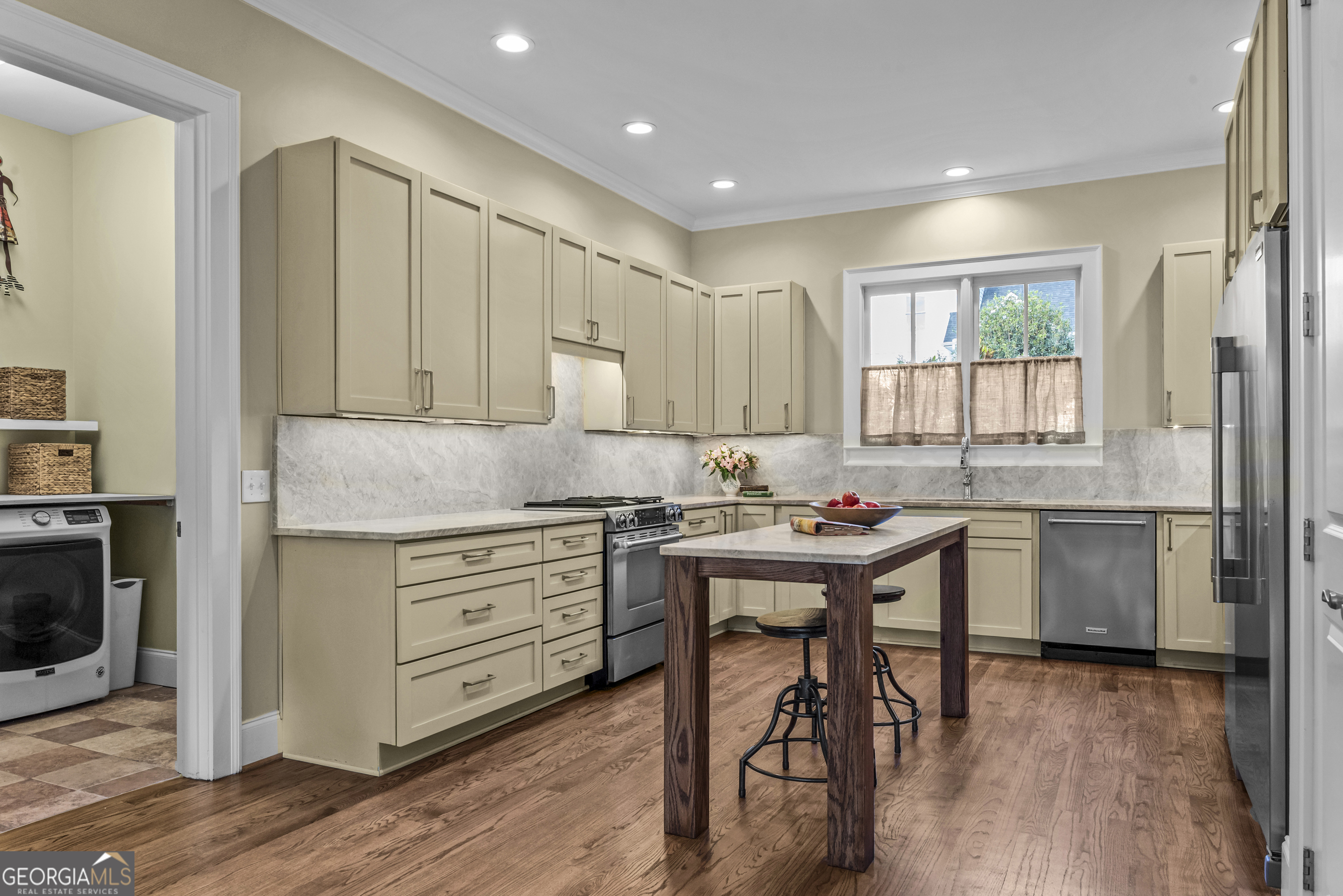 568 New Post Road Madison, GA 30650 - Photo 10 of 58 a kitchen with a sink appliances cabinets and wooden floor
