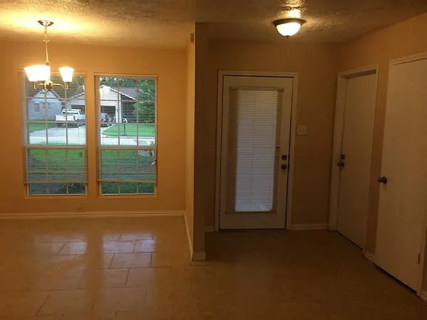 a bathroom with a granite countertop sink toilet and a mirror