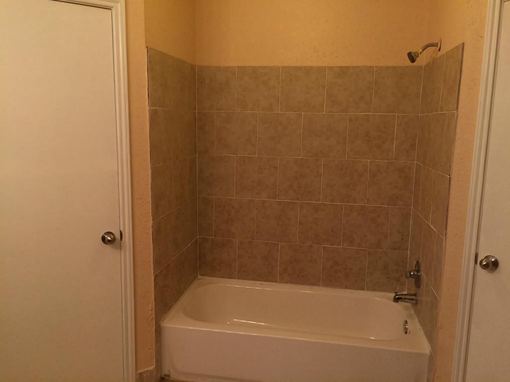 16826 Rippling Mill Drive Sugar Land, TX 77498 - Photo 5 of 18 a bathroom with a bathtub