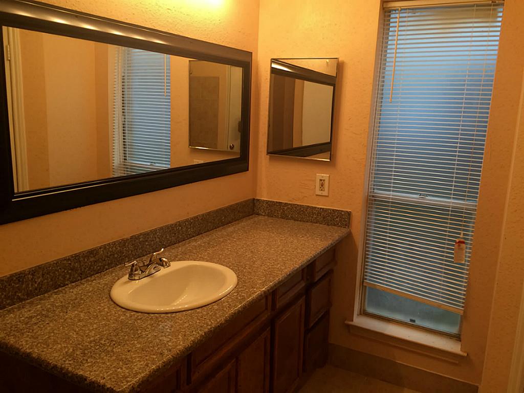16826 Rippling Mill Drive Sugar Land, TX 77498 - Photo 10 of 18 a bathroom with a sink and a mirror