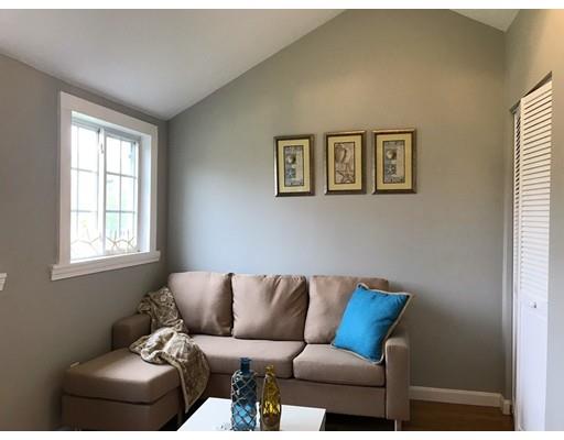 68 Leland Road Marshfield, MA 02050 - Photo 14 of 28 a blue couch sitting next to a window