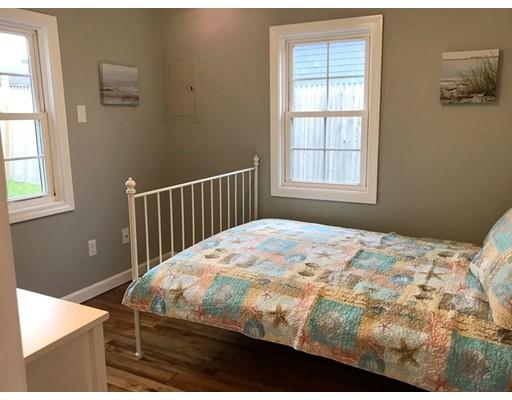 68 Leland Road Marshfield, MA 02050 - Photo 16 of 28 a bedroom with a bed and wooden floor