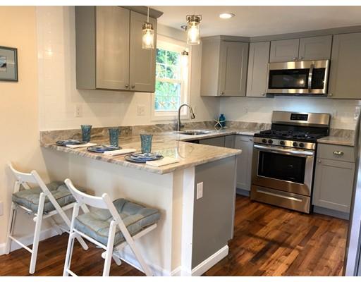 68 Leland Road Marshfield, MA 02050 - Photo 2 of 28 a kitchen with a stove a sink and a microwave