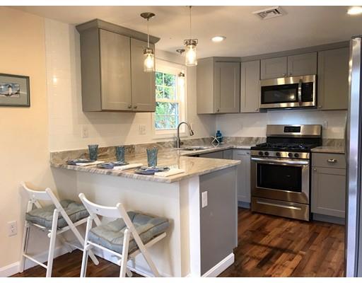 68 Leland Road Marshfield, MA 02050 - Photo 5 of 28 a kitchen with kitchen island granite countertop a sink counter top space appliances and cabinets