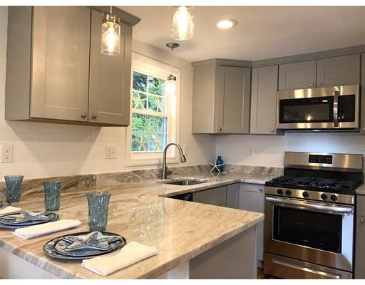 68 Leland Road Marshfield, MA 02050 - Photo 6 of 28 a kitchen with a stove a sink and a microwave