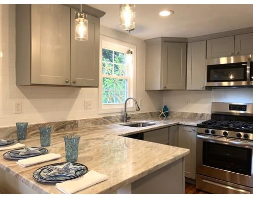 68 Leland Road Marshfield, MA 02050 - Photo 9 of 28 a kitchen with a stove a sink and a microwave