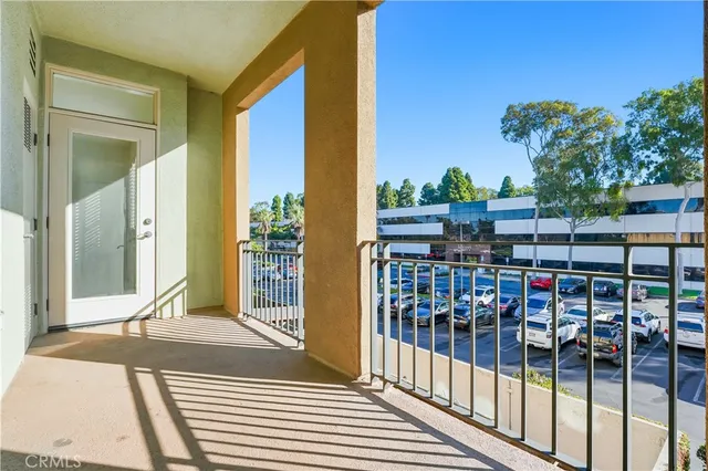 a view of a room with a chandelier fan and windows