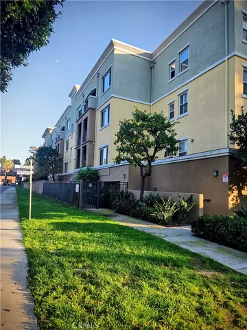a view of a house with a yard and plants