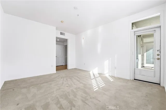 a kitchen with stainless steel appliances granite countertop a sink stove and microwave