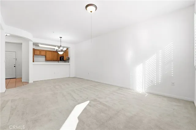 a view of livingroom with furniture and a rug