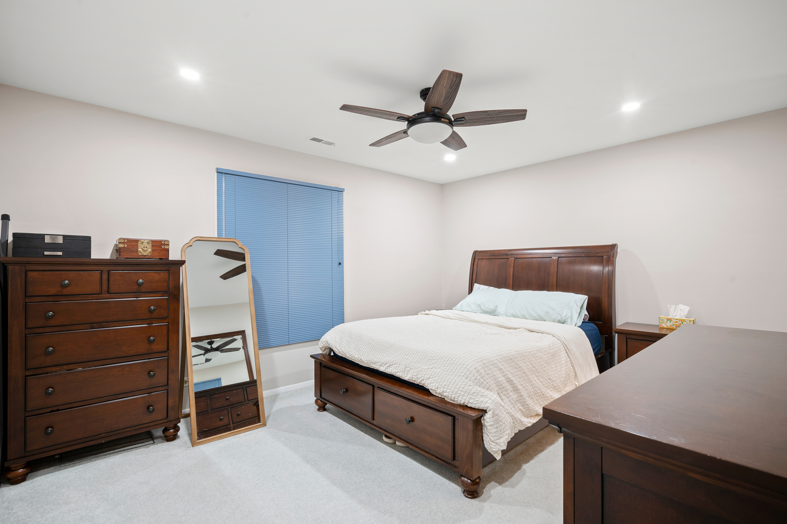 840 Sheldon Court, Unit B Wheaton, IL 60189 - Photo 5 of 13 a bedroom with a bed and a dresser