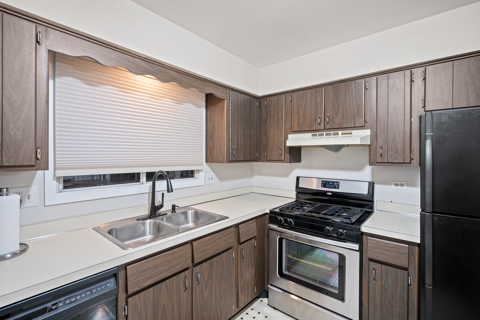 840 Sheldon Court, Unit B Wheaton, IL 60189 - Photo 9 of 13 a kitchen with a sink cabinets and stainless steel appliances