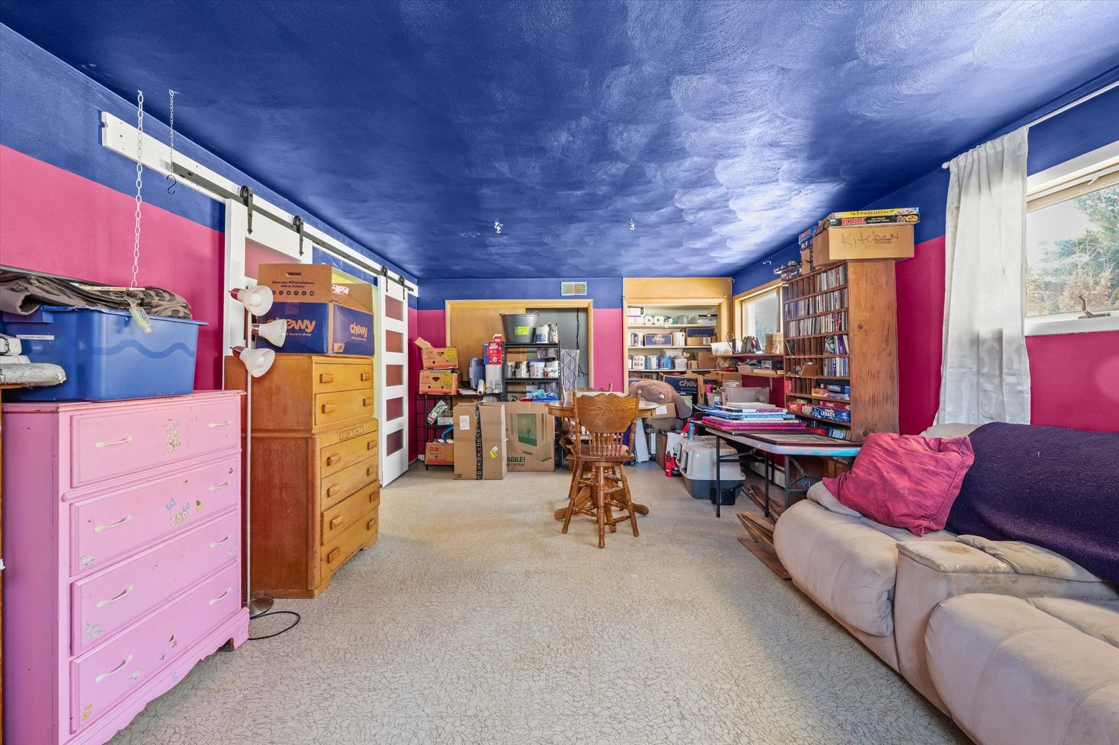 2018 South Cottage Grove Avenue Urbana, IL 61801 - Photo 23 of 31 a living room with furniture a flat screen tv and a large window
