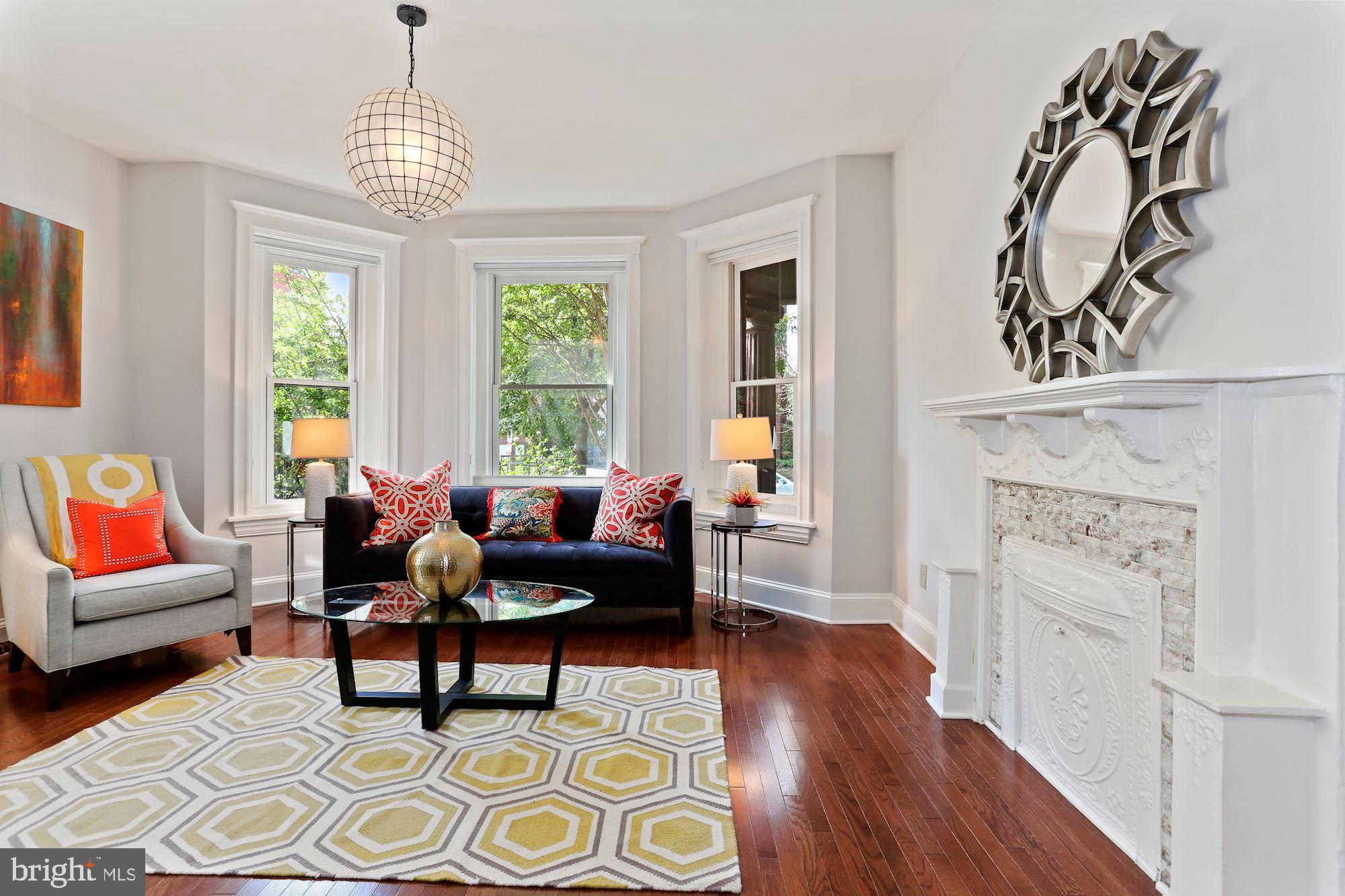1419 R Street Northwest, Unit 10 Washington, DC 20009 - Photo 4 of 22 Sunny front living room with bay window