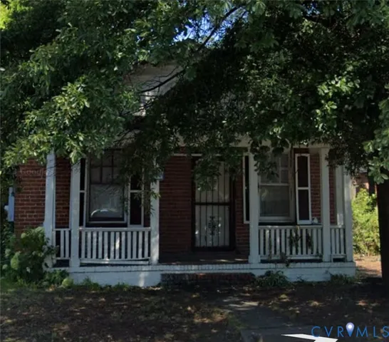 front view of a house with a small yard