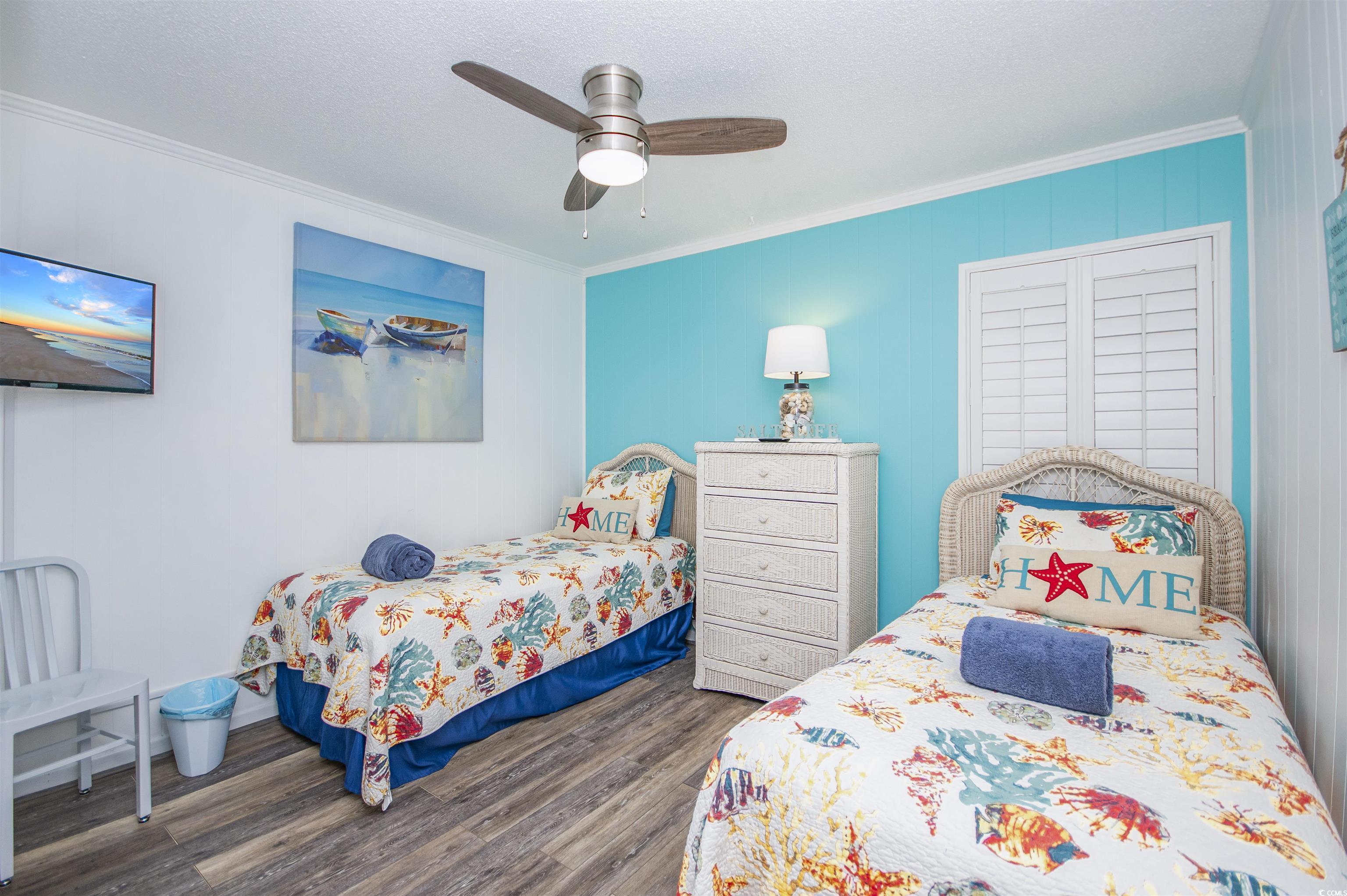 9530 Shore Drive, Unit 2D Myrtle Beach, SC 29572 - Photo 19 of 25 Bedroom featuring ornamental molding, dark wood finished floors, and ceiling fan