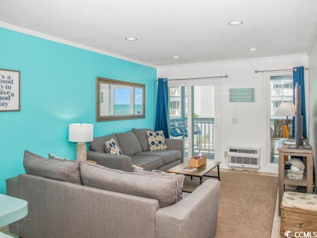 9530 Shore Drive, Unit 2D Myrtle Beach, SC 29572 - Photo 8 of 25 Living area with crown molding and recessed lighting
