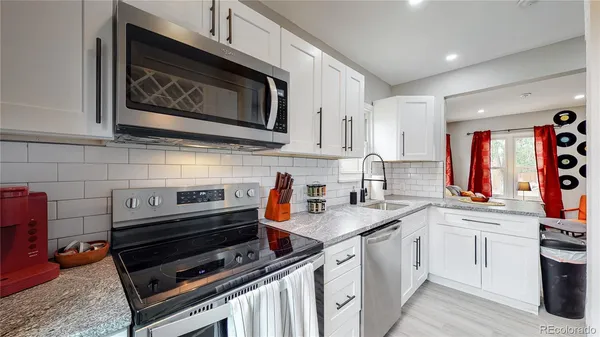 a kitchen with a stove and a microwave