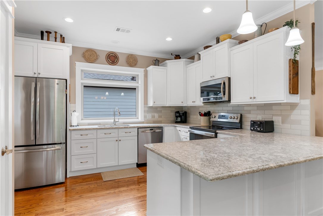 329 High Hampton Road Salem, SC 29676 - Photo 13 of 47 Gleaming hardwood floors and stone countertops anchor this classic kitchen design.