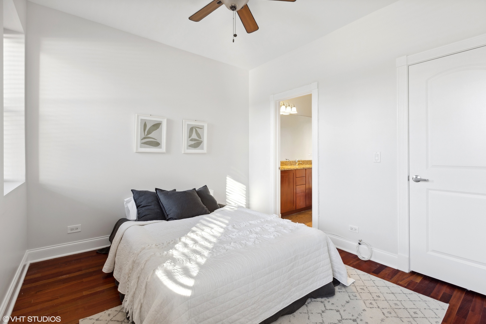 1965 West Cullom Avenue, Unit 3 Chicago, IL 60613 - Photo 11 of 19 a bedroom with a bed and wooden floor