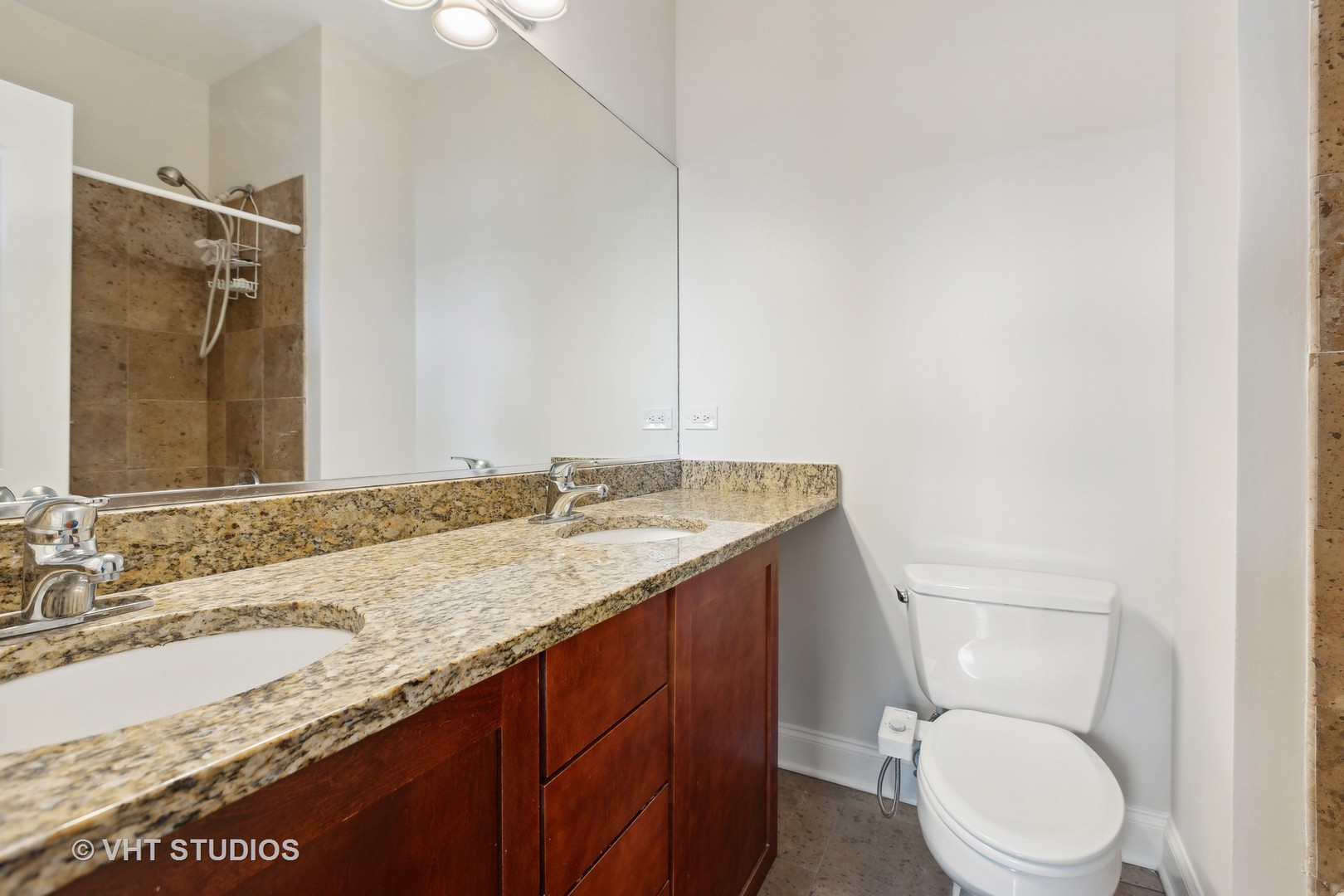 1965 West Cullom Avenue, Unit 3 Chicago, IL 60613 - Photo 12 of 19 a bathroom with a granite countertop toilet sink and mirror