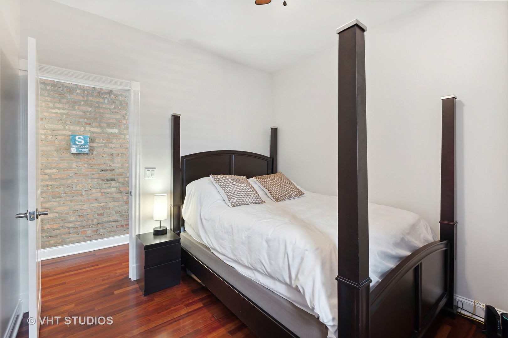 1965 West Cullom Avenue, Unit 3 Chicago, IL 60613 - Photo 14 of 19 a bedroom with a bed and a potted plant next to a window
