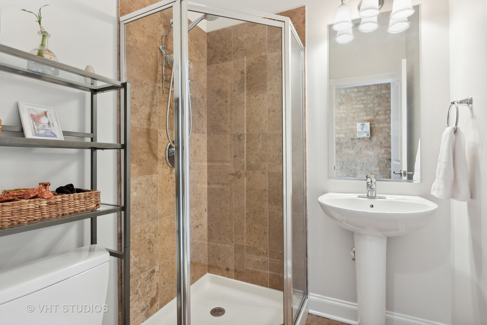 1965 West Cullom Avenue, Unit 3 Chicago, IL 60613 - Photo 16 of 19 a bathroom with a sink a mirror and a shower