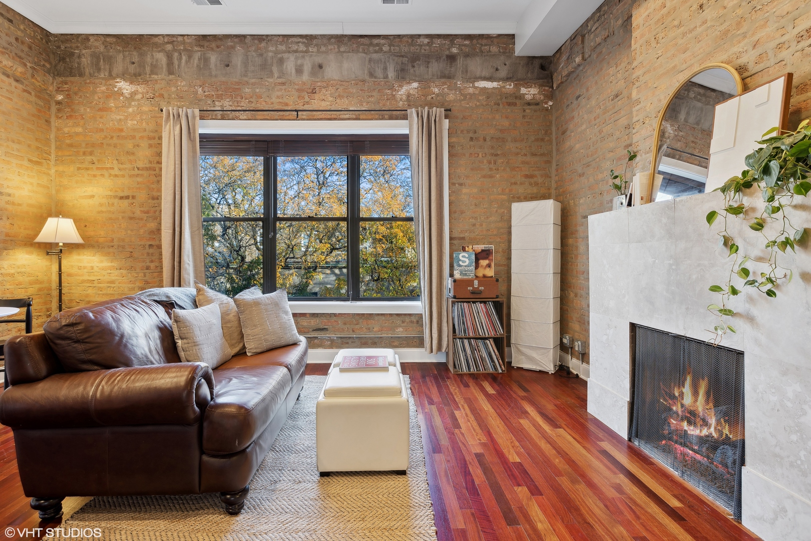 1965 West Cullom Avenue, Unit 3 Chicago, IL 60613 - Photo 3 of 19 a living room with furniture and a fireplace