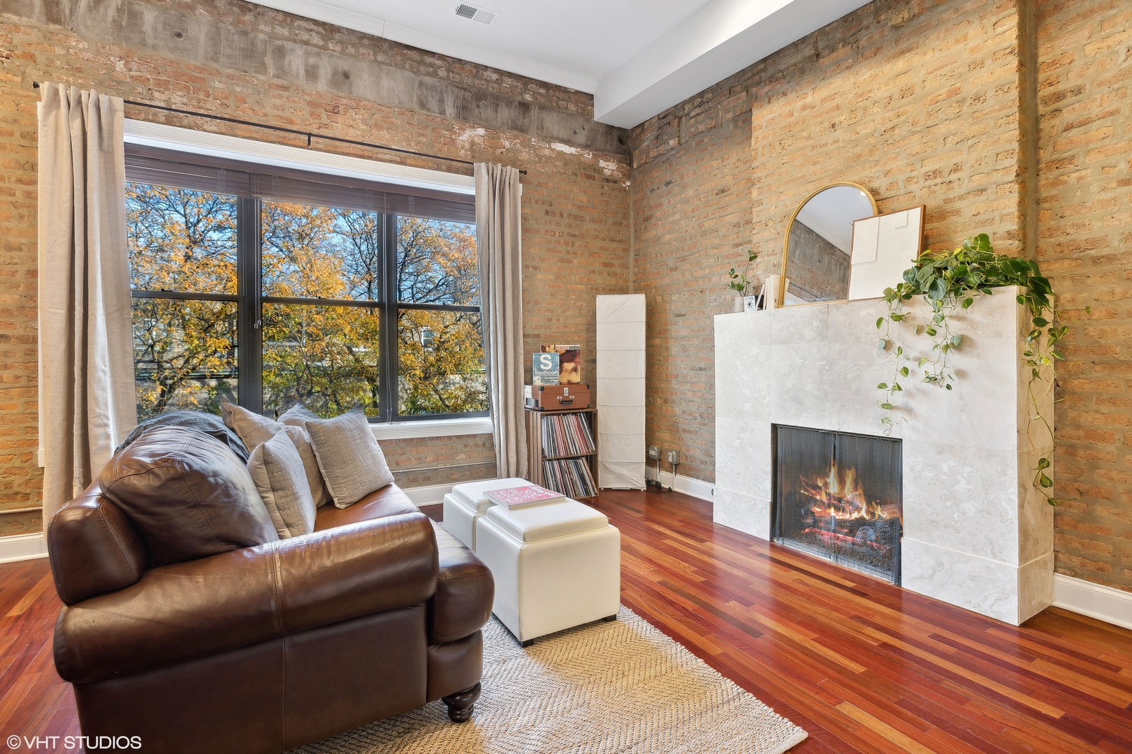 1965 West Cullom Avenue, Unit 3 Chicago, IL 60613 - Photo 4 of 19 a living room with furniture and a fireplace