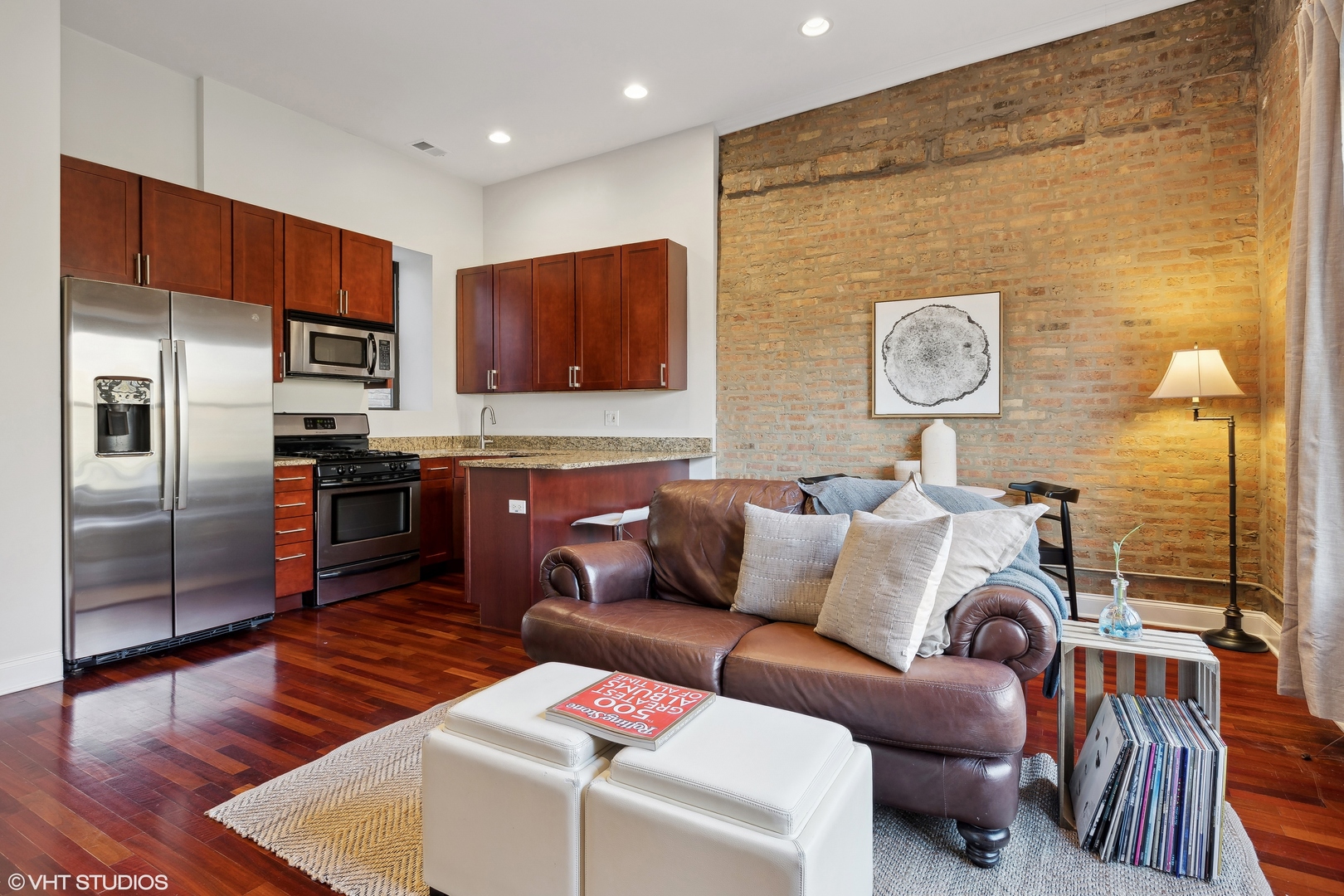 1965 West Cullom Avenue, Unit 3 Chicago, IL 60613 - Photo 5 of 19 a living room with stainless steel appliances furniture a rug and a kitchen view