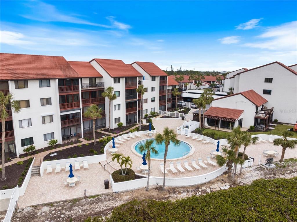 1604 Stickney Point Road, Unit 4102 Sarasota, FL 34231 - Photo 20 of 30 a view of a patio with swimming pool