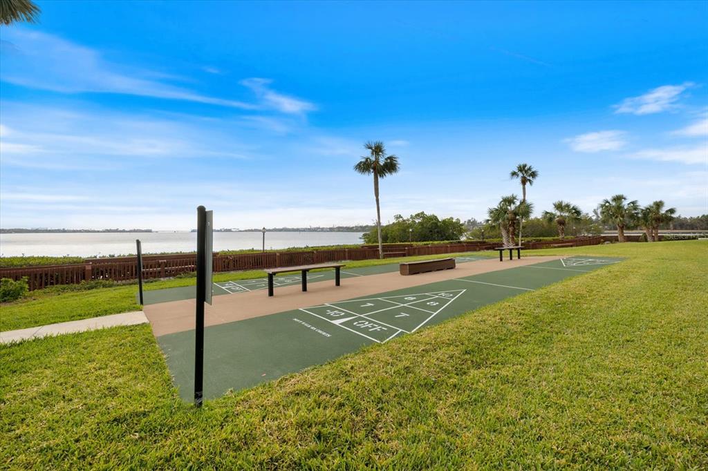 1604 Stickney Point Road, Unit 4102 Sarasota, FL 34231 - Photo 24 of 30 a view of a swimming pool and an outdoor seating