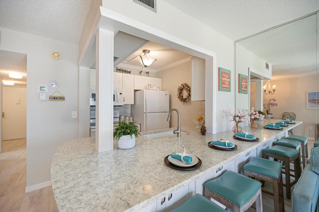 1604 Stickney Point Road, Unit 4102 Sarasota, FL 34231 - Photo 6 of 30 a view of a dining room and furniture