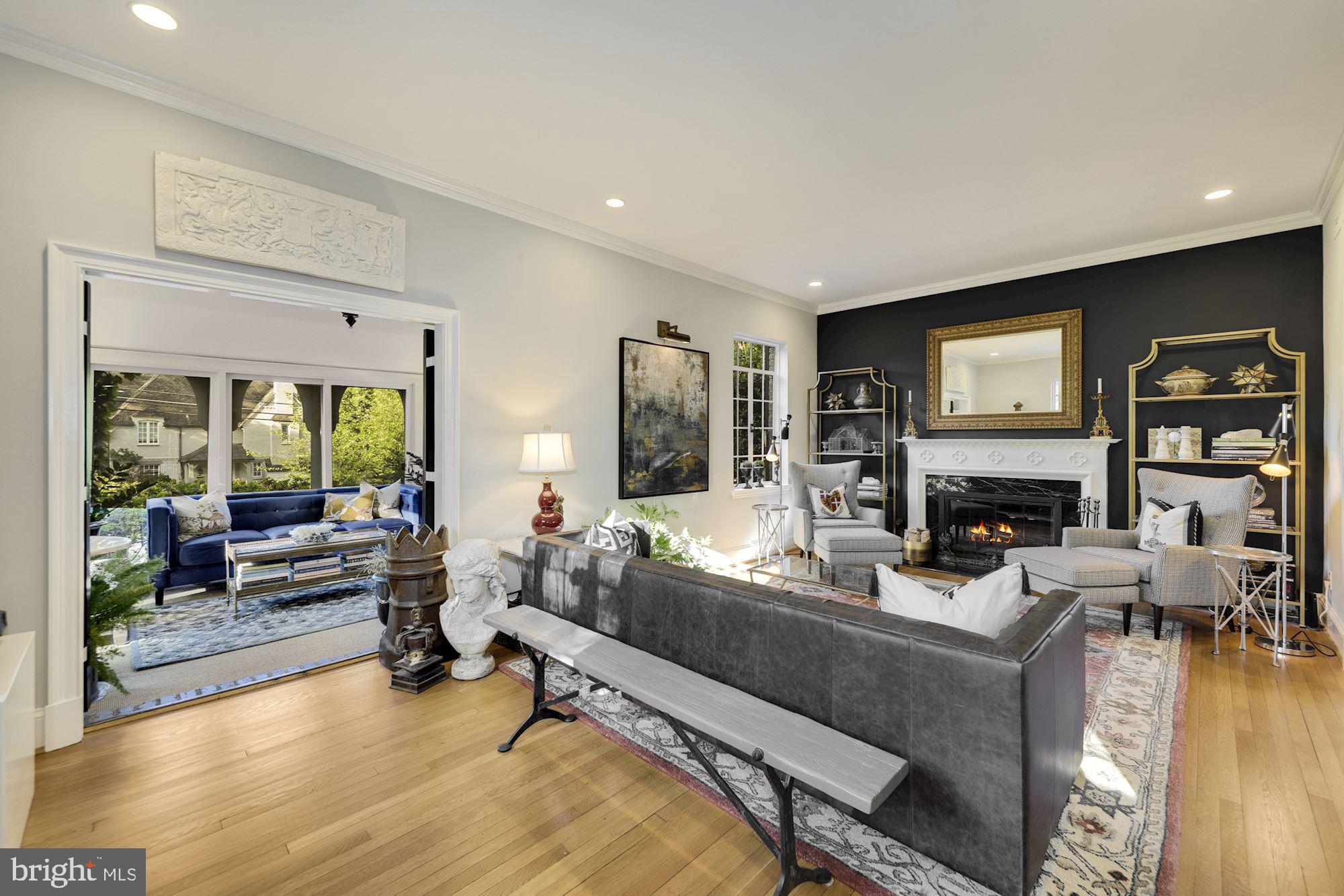 3110 Rolling Road Chevy Chase, MD 20815 - Photo 8 of 46 Living Room With White Oak Floors + Fireplace