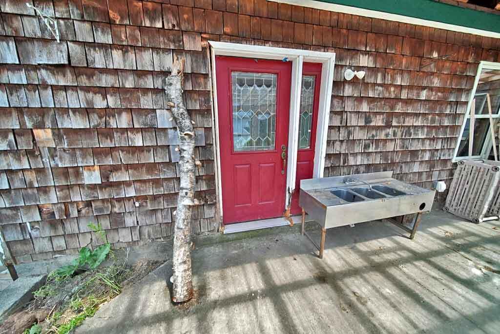 808 Skedgell Road Orient, ME 04471 - Photo 85 of 100 entry-back-door-off-greenho