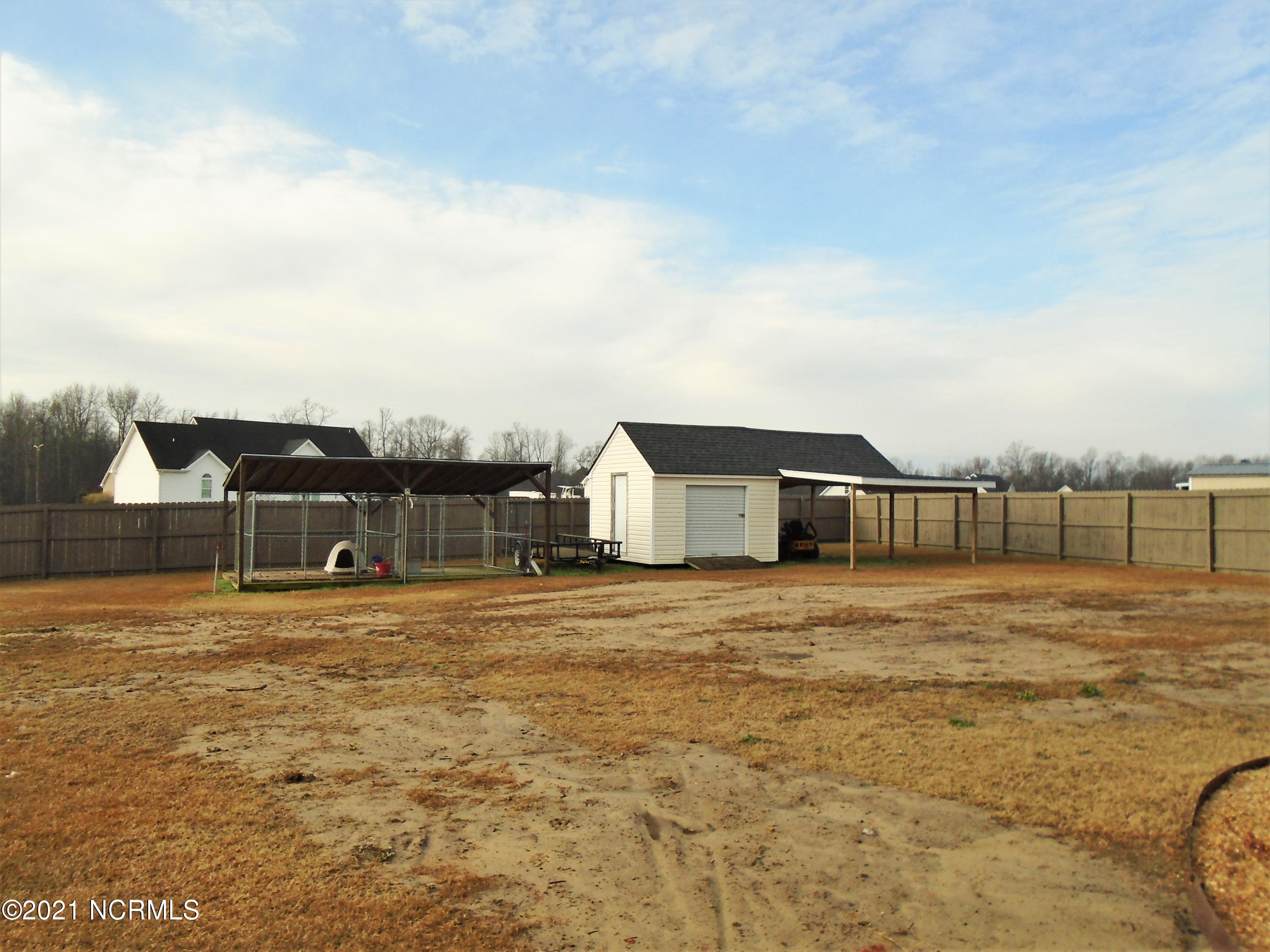 4033 Baybrook Road Nashville, NC 27856 - Photo 11 of 46 Detached storage building in the rear.