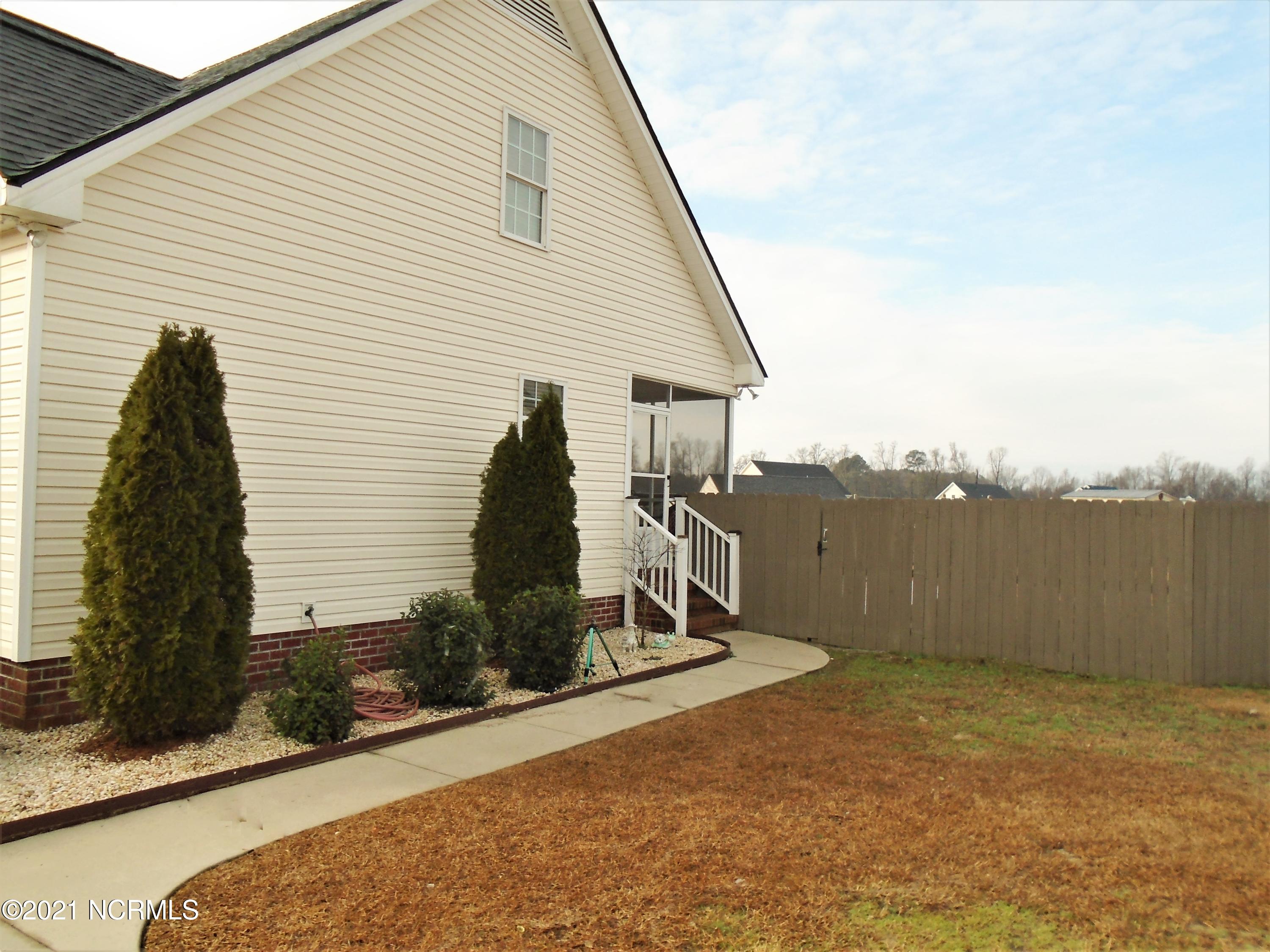 4033 Baybrook Road Nashville, NC 27856 - Photo 6 of 46 Privacy fenced rear yard.