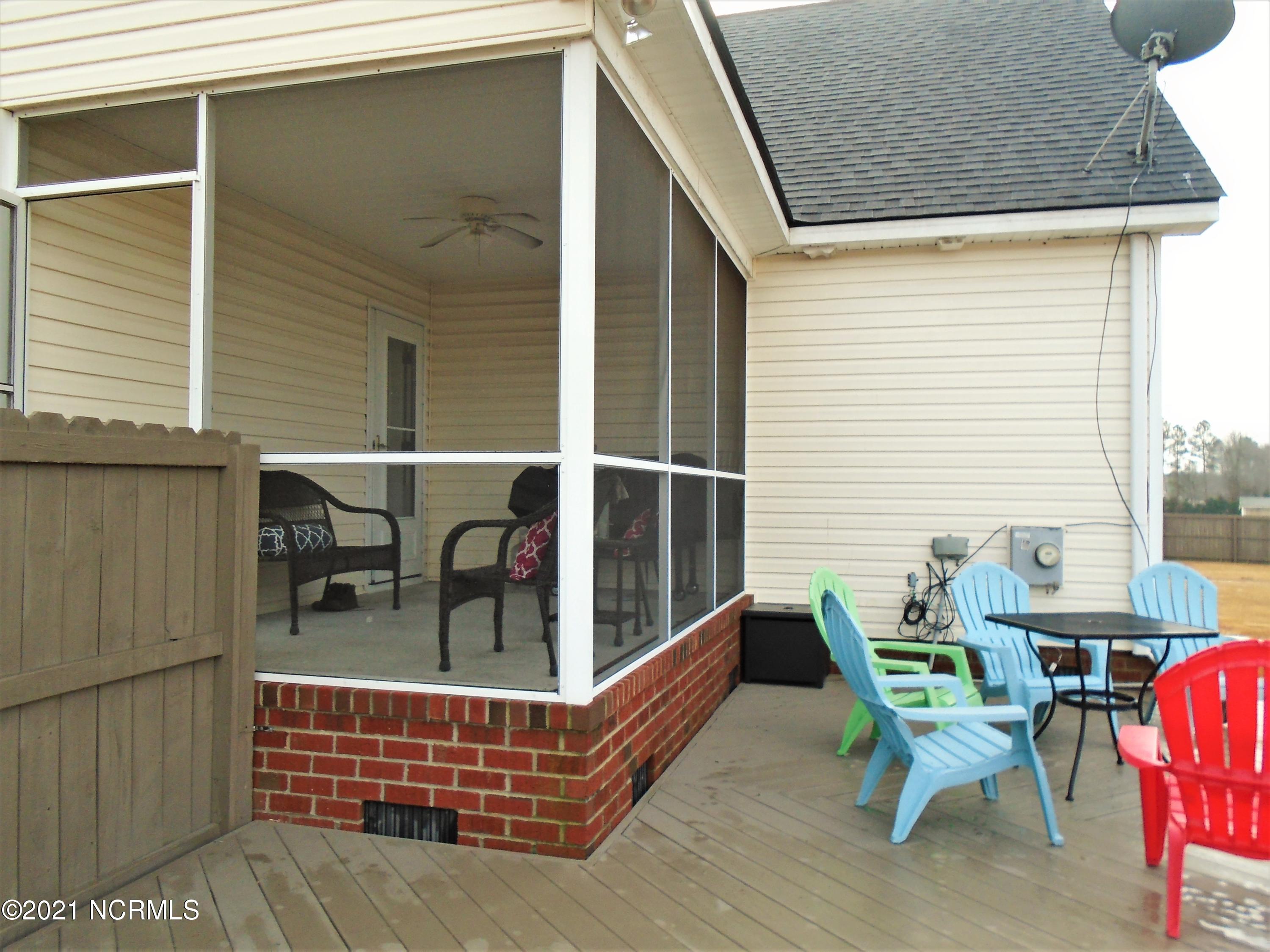 4033 Baybrook Road Nashville, NC 27856 - Photo 8 of 46 Screened porch and low-rise decking...