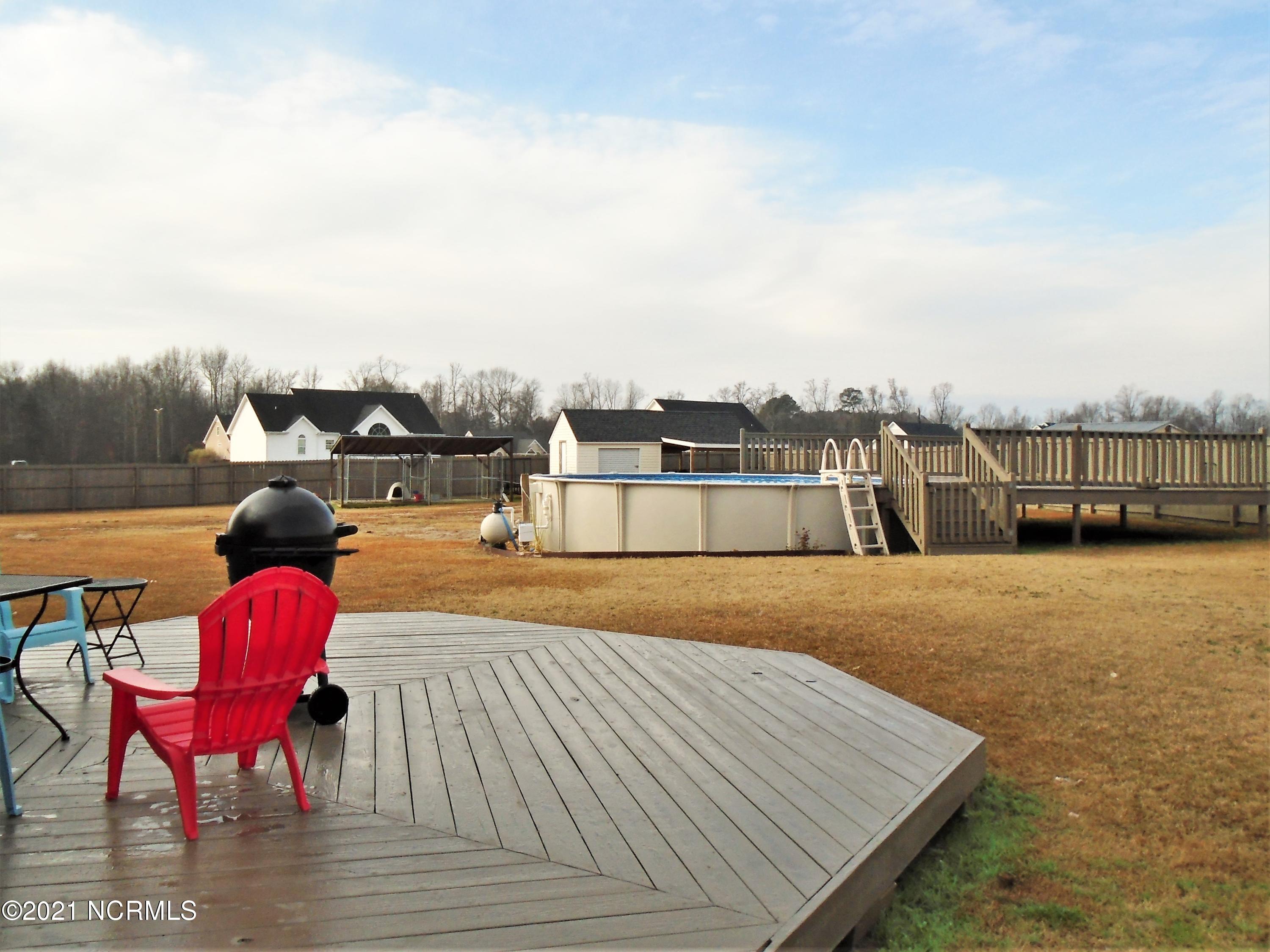 4033 Baybrook Road Nashville, NC 27856 - Photo 9 of 46 Huge above ground pool with attached decking...