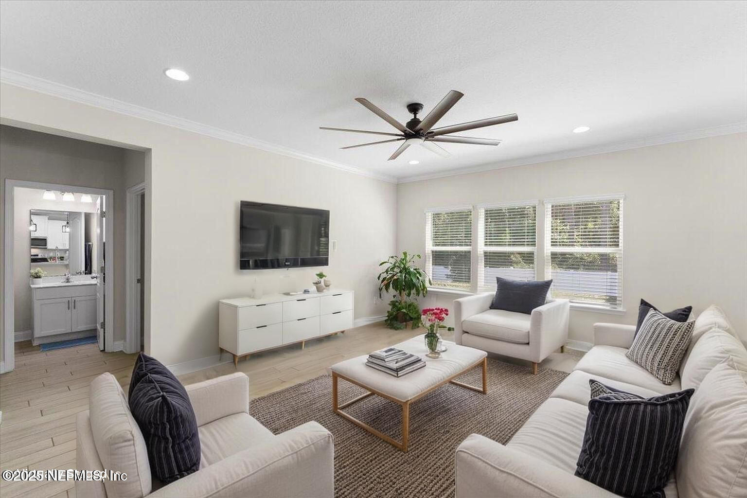 3060 Free Bird Loop Green Cove Springs, FL 32043 - Photo 16 of 94 a living room with furniture and a flat screen tv