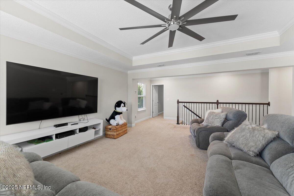 3060 Free Bird Loop Green Cove Springs, FL 32043 - Photo 19 of 94 a living room with furniture and a flat screen tv