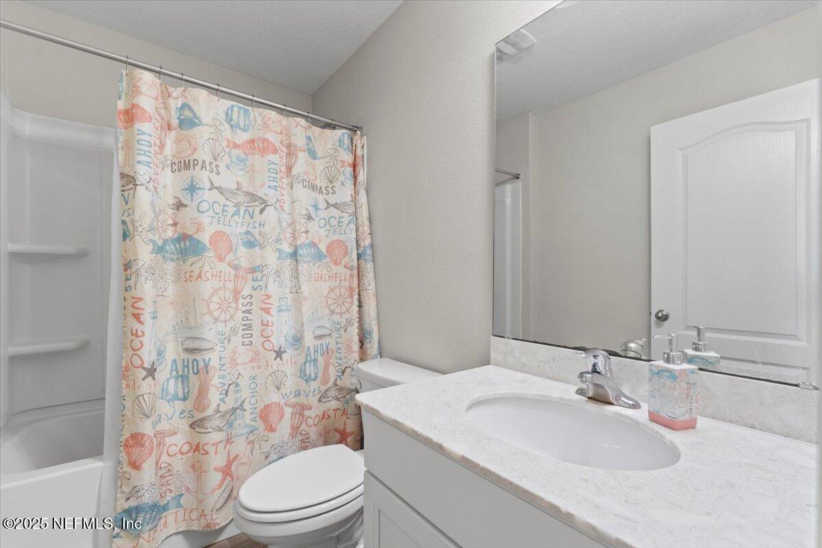 3060 Free Bird Loop Green Cove Springs, FL 32043 - Photo 24 of 94 a bathroom with a sink toilet and shower